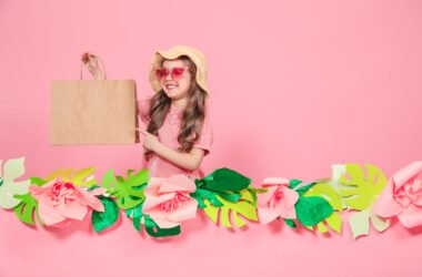 Portrait of cute little girl with shopping bag